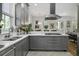 Modern kitchen featuring a gas range, stainless steel appliances, and an island sink at 17 Trumbo St, Charleston, SC 29401