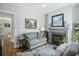 Inviting living room with a fireplace, light blue sofa, and elegant décor at 17 Trumbo St, Charleston, SC 29401