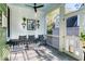 Relaxing porch with comfortable furniture, potted plants, and an open view at 17 Trumbo St, Charleston, SC 29401
