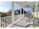 Inviting porch with views of the neighborhood and comfortable seating for relaxing outdoors at 17 Trumbo St, Charleston, SC 29401