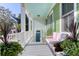 Inviting porch with comfortable seating, featuring a light blue ceiling and views of the neighborhood at 17 Trumbo St, Charleston, SC 29401