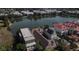 Aerial view of a lakeside neighborhood showcasing beautiful homes with unique architectural styles and lush landscaping at 186 N Shelmore Blvd, Mount Pleasant, SC 29464