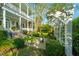 Idyllic backyard with a fountain, pergola, and manicured landscaping, enhancing the outdoor living space at 186 N Shelmore Blvd, Mount Pleasant, SC 29464
