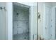 Modern bathroom features a glass-enclosed marble shower with rainfall showerhead and built-in niche at 186 N Shelmore Blvd, Mount Pleasant, SC 29464