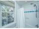 Bathroom featuring shower with dual shower heads and large bright window at 186 N Shelmore Blvd, Mount Pleasant, SC 29464
