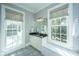 Bright bathroom featuring dual windows, natural light, and granite vanity at 186 N Shelmore Blvd, Mount Pleasant, SC 29464