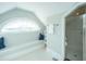 Bright bathroom features large arched window, a comfortable bench seat and a glass shower at 186 N Shelmore Blvd, Mount Pleasant, SC 29464