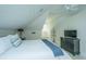 Cozy bedroom with vaulted ceilings, paneled walls, a ceiling fan and a comfortable queen size bed at 186 N Shelmore Blvd, Mount Pleasant, SC 29464