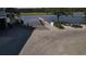 View of a private dock with a boat ramp and picnic tables, ideal for waterfront enjoyment and relaxation at 186 N Shelmore Blvd, Mount Pleasant, SC 29464