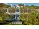 Stately two-story home with double porches and lush landscaping at 186 N Shelmore Blvd, Mount Pleasant, SC 29464