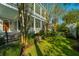 Beautiful front yard with lush landscaping and a stately home with double porches at 186 N Shelmore Blvd, Mount Pleasant, SC 29464