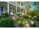Attractive home with a water feature, brick steps, and lush landscaping at 186 N Shelmore Blvd, Mount Pleasant, SC 29464