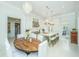 Bright eat-in kitchen featuring a large island with bar stool seating, stainless steel appliances and a chandelier at 186 N Shelmore Blvd, Mount Pleasant, SC 29464