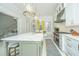 Spacious kitchen with a center island, high-end appliances, and a bright breakfast nook at 186 N Shelmore Blvd, Mount Pleasant, SC 29464