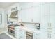 Well-equipped kitchen featuring an island, stainless steel appliances, and custom cabinets at 186 N Shelmore Blvd, Mount Pleasant, SC 29464