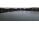 Scenic lake view surrounded by trees and residential homes, offering a serene and picturesque setting at 186 N Shelmore Blvd, Mount Pleasant, SC 29464