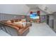 Cozy living room with comfortable leather seating, built-in shelves, and a large flat-screen television at 186 N Shelmore Blvd, Mount Pleasant, SC 29464