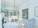 Bright living room featuring a fireplace, chandelier, built-in bookshelves, and comfortable furniture at 186 N Shelmore Blvd, Mount Pleasant, SC 29464