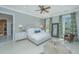 Inviting bedroom with a large bed, dresser, hardwood floors, and natural light at 186 N Shelmore Blvd, Mount Pleasant, SC 29464