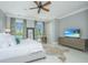 Spacious bedroom featuring hardwood floors, a ceiling fan, and large windows at 186 N Shelmore Blvd, Mount Pleasant, SC 29464