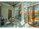 Cozy screened porch with a ceiling fan and a view of the outdoors at 186 N Shelmore Blvd, Mount Pleasant, SC 29464