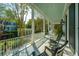 Picturesque porch with rocking chairs and views of the landscaped yard at 186 N Shelmore Blvd, Mount Pleasant, SC 29464