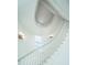 Bright and open staircase featuring a curved banister, window, and sconce lighting at 186 N Shelmore Blvd, Mount Pleasant, SC 29464