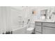 Clean bathroom featuring a shower-tub combo with white tile surround, a neutral vanity, and contemporary fixtures at 200 Belfort Place, Summerville, SC 29486