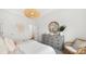Bright bedroom features a dresser, unique light fixture, and stylish decor, creating a serene and comfortable space at 200 Belfort Place, Summerville, SC 29486