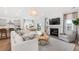 An inviting living space featuring a fireplace, modern furnishings, and an open layout that connects seamlessly to the kitchen at 200 Belfort Place, Summerville, SC 29486
