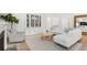 Bright, neutral living space featuring hardwood floors, a stylish cabinet, and comfortable seating arrangements at 200 Belfort Place, Summerville, SC 29486