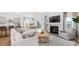 Inviting living area with a fireplace, modern furniture, and an open-concept layout that flows into the kitchen and dining space at 200 Belfort Place, Summerville, SC 29486