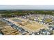 Serene aerial view of a neighborhood featuring green spaces and a pond at 208 Evergreen Ave, Summerville, SC 29485