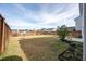 Fenced backyard featuring a well-manicured lawn and mature landscaping at 208 Evergreen Ave, Summerville, SC 29485