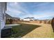 Spacious backyard with a wood fence, patio, and grass at 208 Evergreen Ave, Summerville, SC 29485