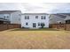 View of the backyard with a wood fence and a lush lawn, creating a private outdoor space at 208 Evergreen Ave, Summerville, SC 29485