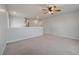 Bright bonus room with neutral carpet, a ceiling fan, and plenty of natural light at 208 Evergreen Ave, Summerville, SC 29485