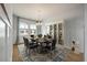 Elegant dining room with stylish furniture, wainscoting, and natural light at 208 Evergreen Ave, Summerville, SC 29485