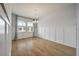 Bright dining room with hardwood floors, wainscoting, and natural light from large windows at 208 Evergreen Ave, Summerville, SC 29485