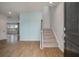 Inviting entryway with hardwood floors, staircase, and a serene blue accent wall at 208 Evergreen Ave, Summerville, SC 29485