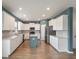 Modern kitchen with white cabinets, stainless steel appliances, a kitchen island, and recessed lighting at 208 Evergreen Ave, Summerville, SC 29485