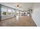 Open-concept living area with hardwood floors and a view of the modern kitchen at 208 Evergreen Ave, Summerville, SC 29485