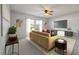 Comfortable living room with neutral tones, ceiling fan, and a large television for modern relaxation at 208 Evergreen Ave, Summerville, SC 29485