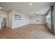 Open living room with wood floors, a modern shiplap accent wall, and plenty of light at 208 Evergreen Ave, Summerville, SC 29485
