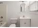 Clean bathroom features a shower-tub combo, sleek vanity, neutral wall paint, and bright light at 209 E 1St N St, Summerville, SC 29483