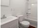 Bathroom featuring tub, shower, and sink with white cabinetry at 209 E 1St N St, Summerville, SC 29483