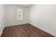 Cozy bedroom with hardwood floors, natural light, and large window views at 209 E 1St N St, Summerville, SC 29483