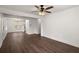 Spacious living room featuring hardwood floors, neutral walls, and a ceiling fan at 209 E 1St N St, Summerville, SC 29483