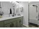 Modern bathroom with updated fixtures, stylish wallpaper, and a shower at 214 Terry Ave, Summerville, SC 29485