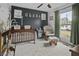 Cozy Bedroom featuring a wooden crib, glider chair, and cheerful decor at 214 Terry Ave, Summerville, SC 29485